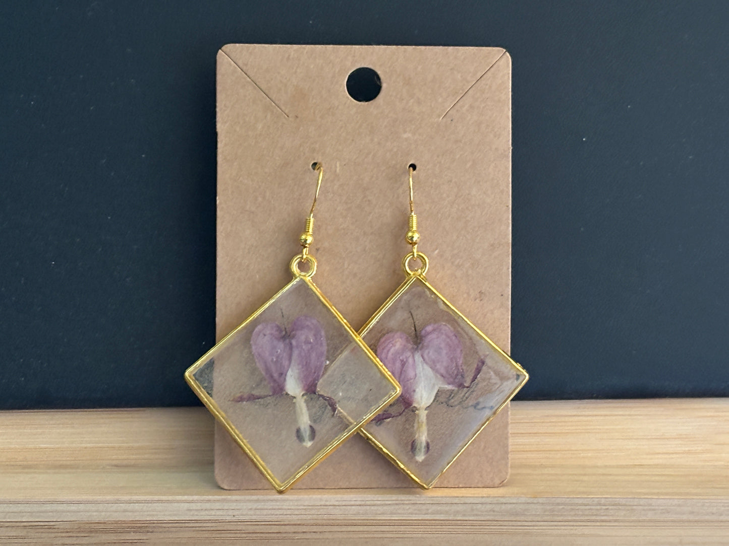 Bleeding Heart in Clear on Gold Toned Triangle Earrings