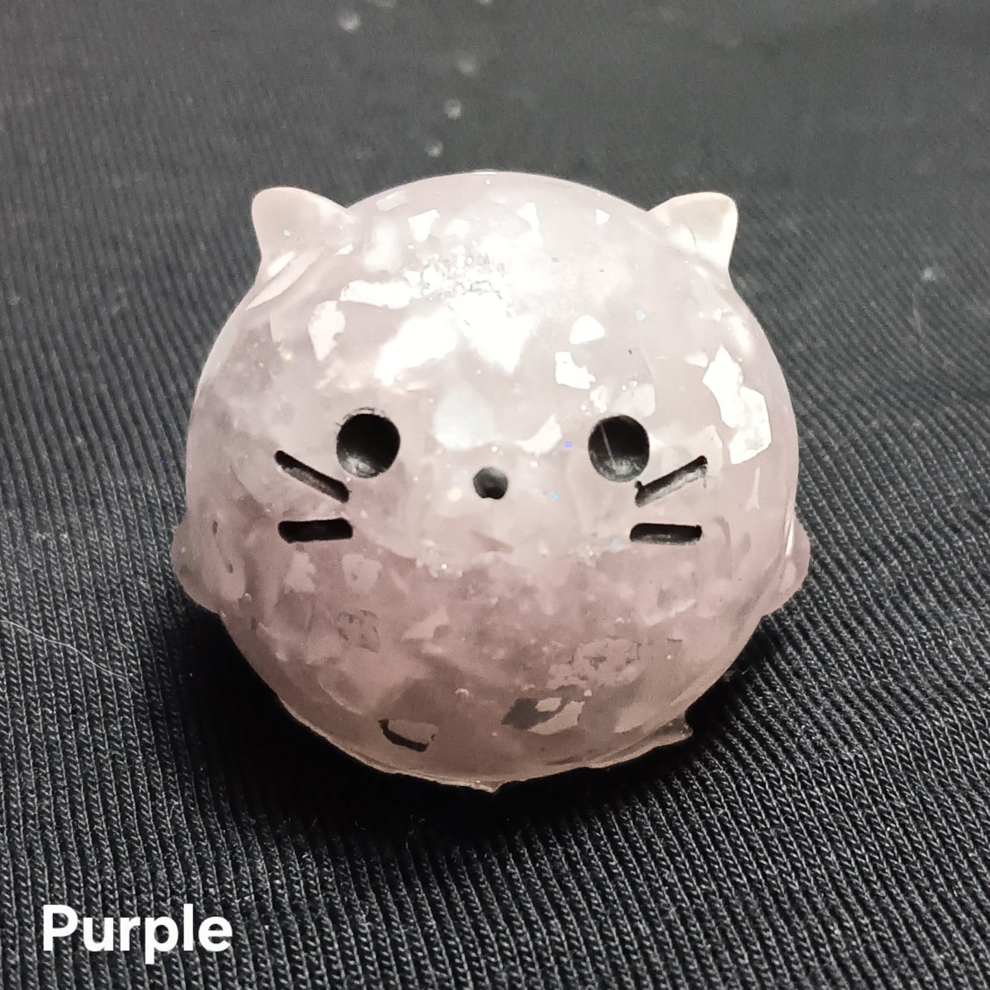 Mini pet cat toy, glitter purple ball with cat ears and cutout face details