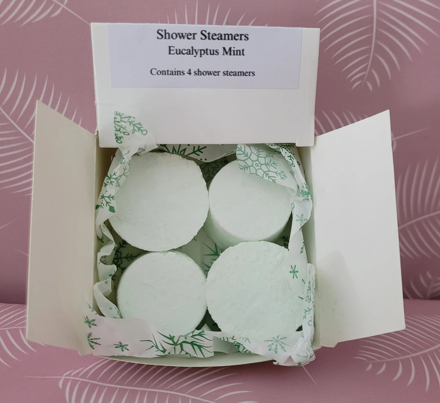 Shower steamer set with four round mint-eucalyptus tablets