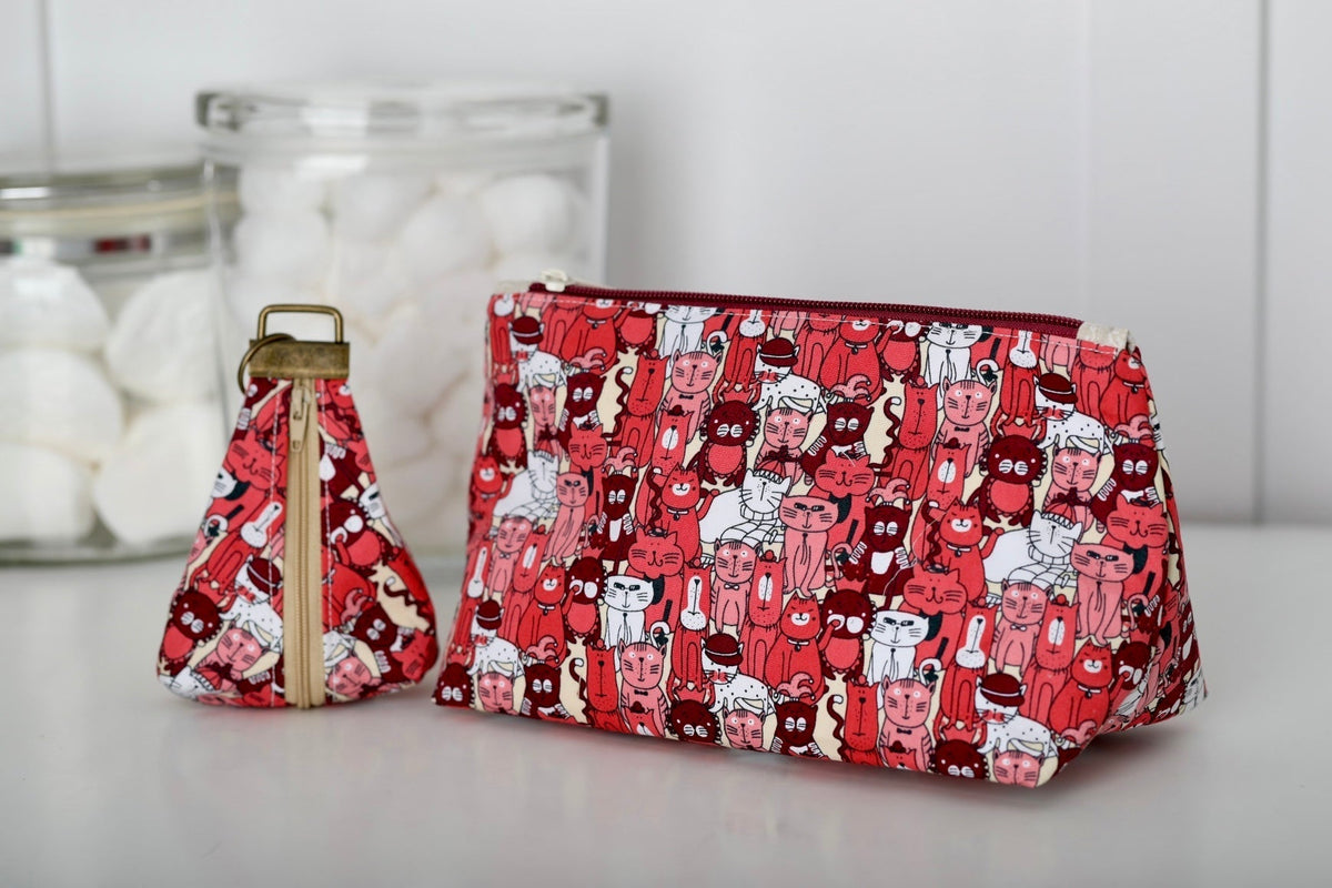Red cat-print zip cosmetic bag with matching mini bag, flat pouch shape