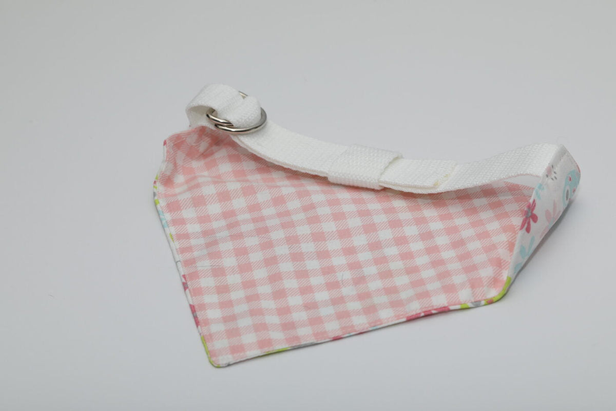 Dog bandana with pink gingham pattern and white adjustable strap