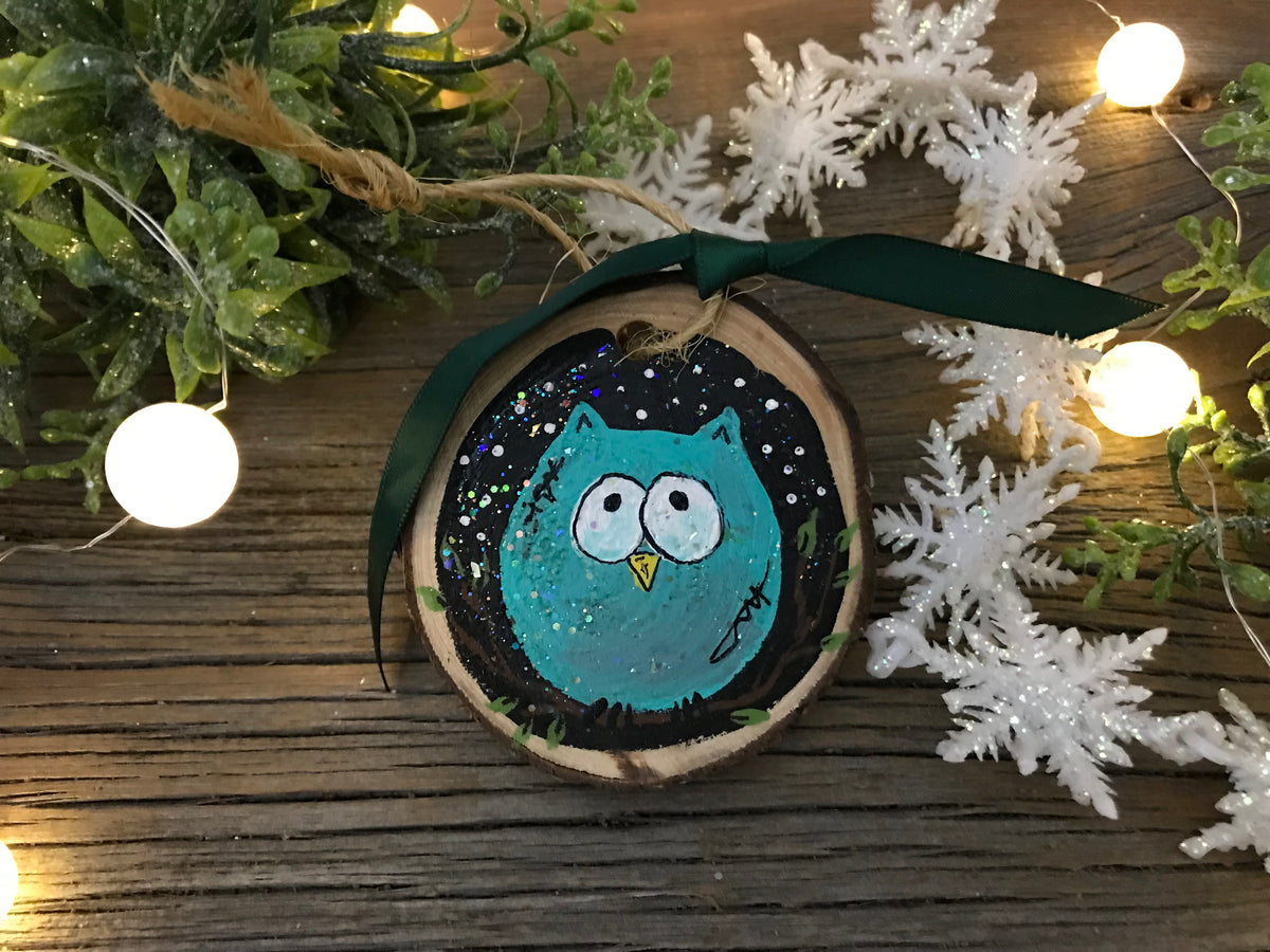 Hand-painted wooden owl ornament with teal owl on round dark wood, green hanging loop