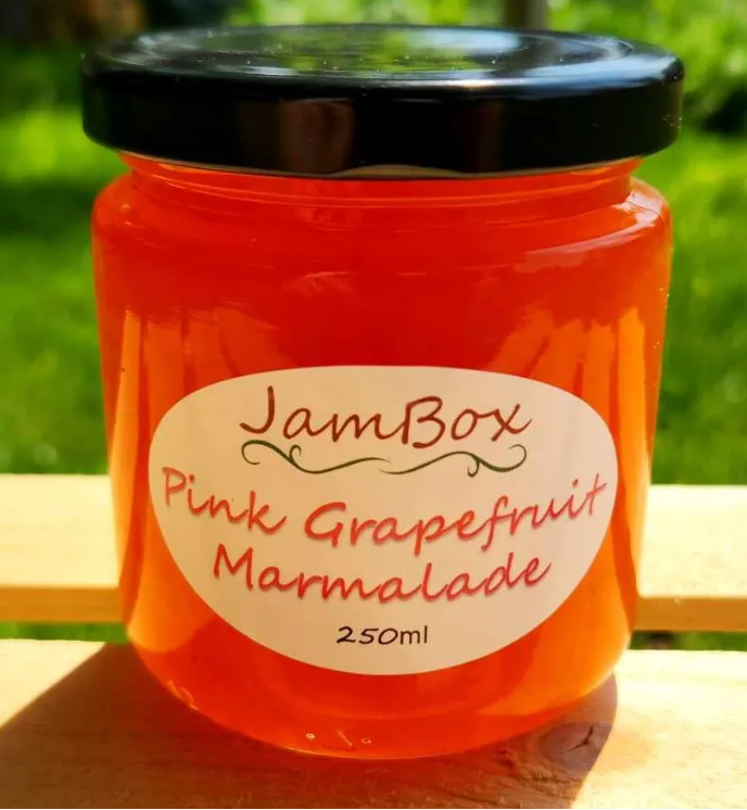 Pink grapefruit marmalade in a glass jar with JamBox label, 250 mL