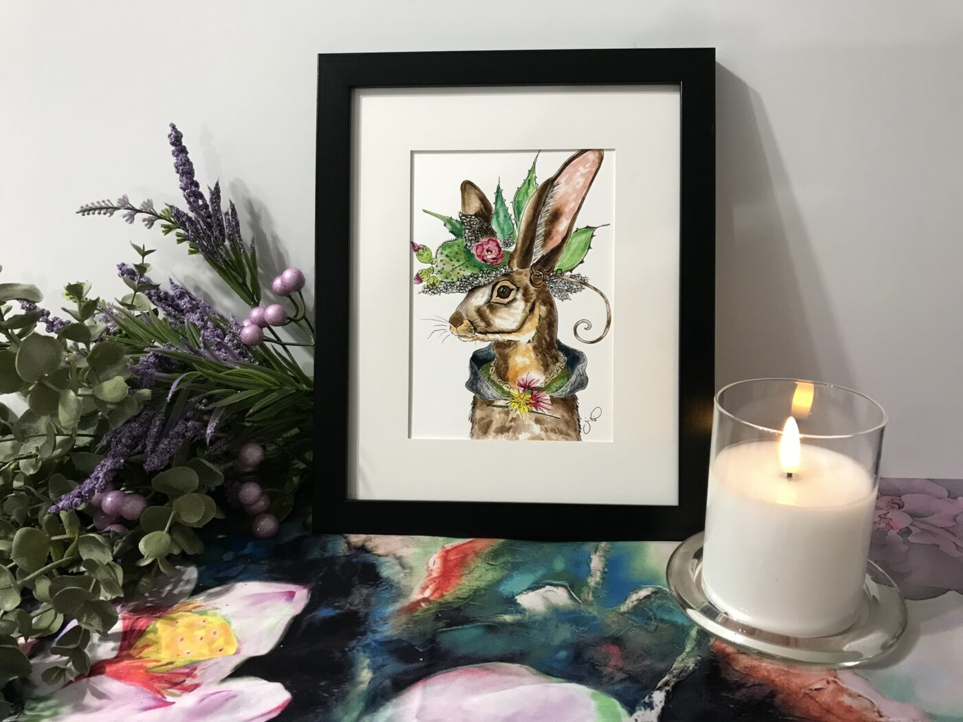 Framed watercolor rabbit illustration with hat and colorful details