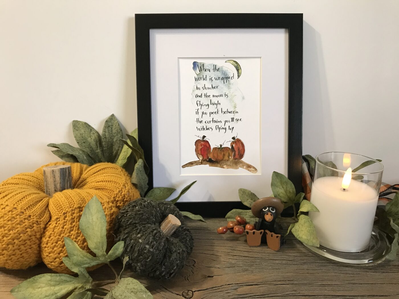 Framed illustrated quote wall art with dark border and small woodland animals