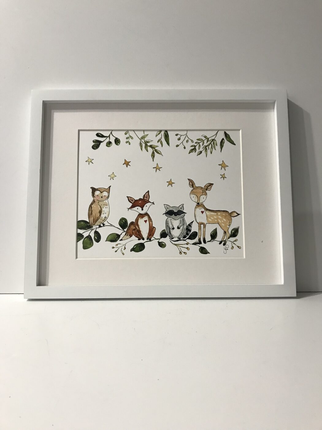 Framed woodland animal print with cats, owls, fox, deer, stars, and leafy branches