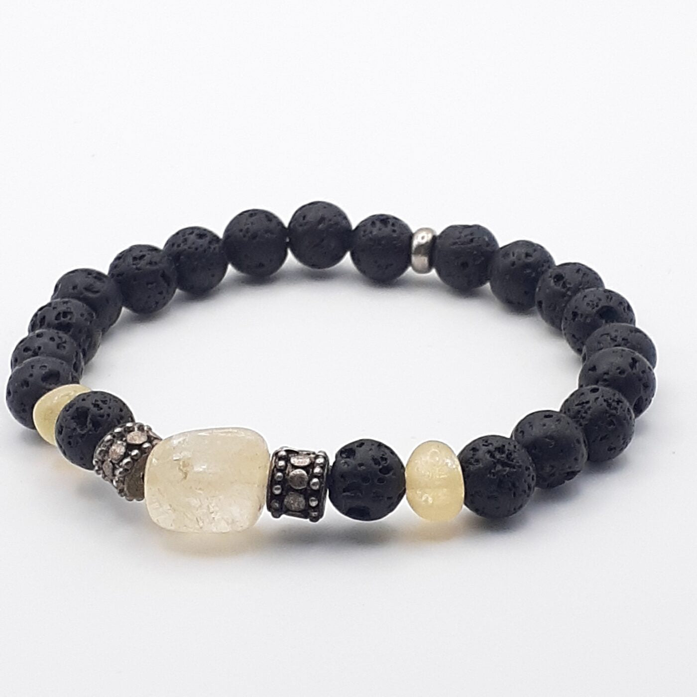 Stretch gemstone bracelet with black lava beads and citrine nugget accents, silver spacer.