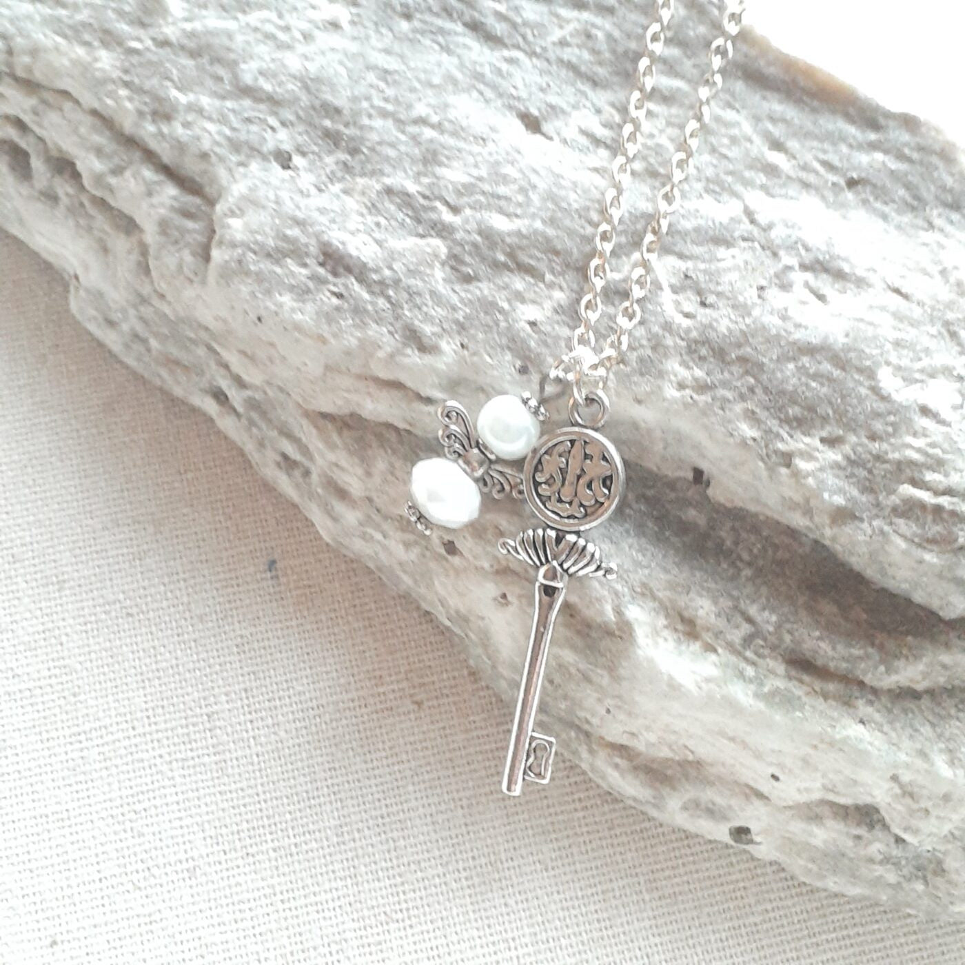 Opaque White Faceted Czech Crystal and Pearl Tiny Guardian Angel Charm and Tibetan Silver 3D Key Charm on a Sterling Silver Necklace Chain