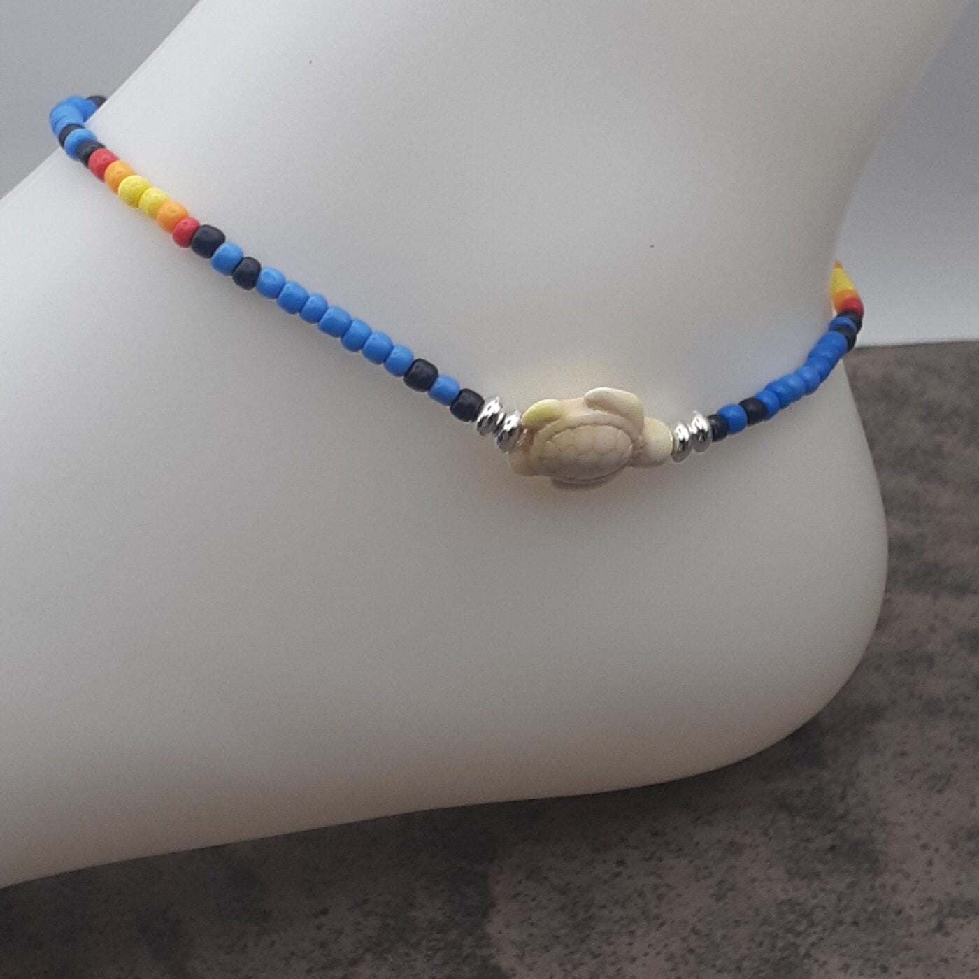 Seaturtle Sensation Colourful Seed Bead Anklet in Bands of Blues, Sunny Yellows, Reds, and Black