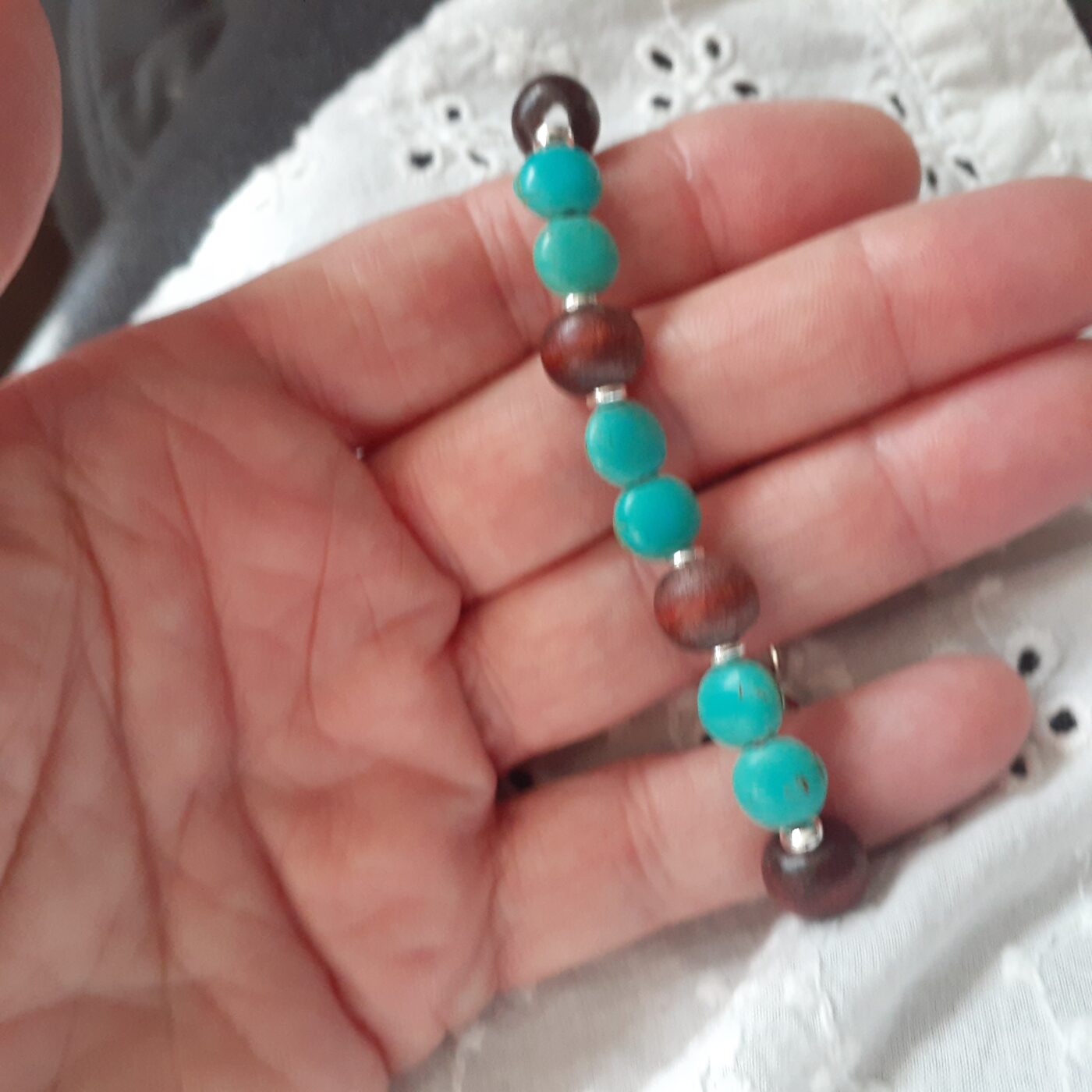 Turquoise Howlite and Natural Wood Beaded Stretch-Style Bracelet with Silver Chain and Tiny Detailed Pinecone Dangling Charm