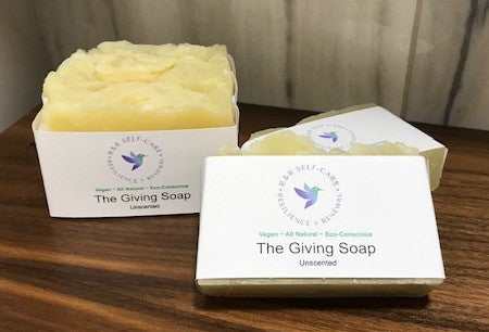 Unscented soap bars, pale yellow, in The Giving Soap white boxes