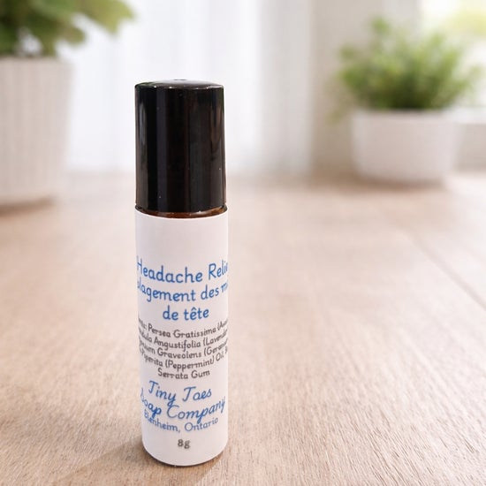 Essential oil roller bottle with black cap; white label text, 8g