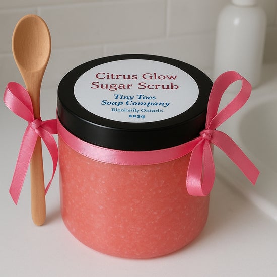 Pink citrus sugar scrub jar with black lid and pink ribbon bows, 225g