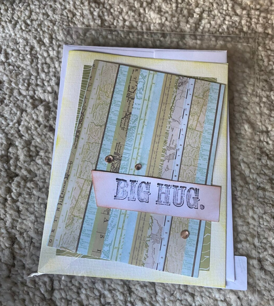 Striped greeting card with 'BIG HUG.' message and ribbon border