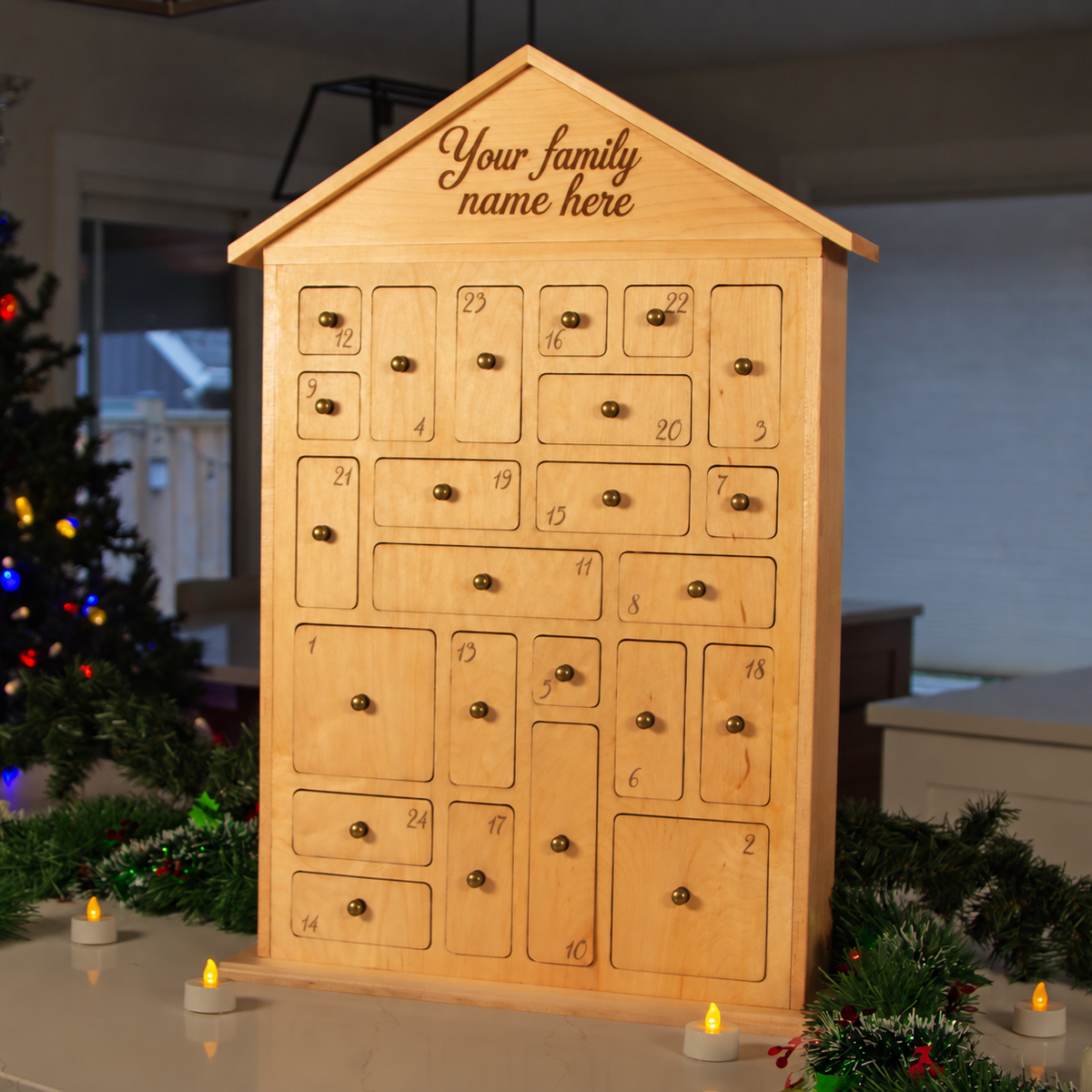 Personalized wooden house-shaped advent calendar board with numbered cookie slots