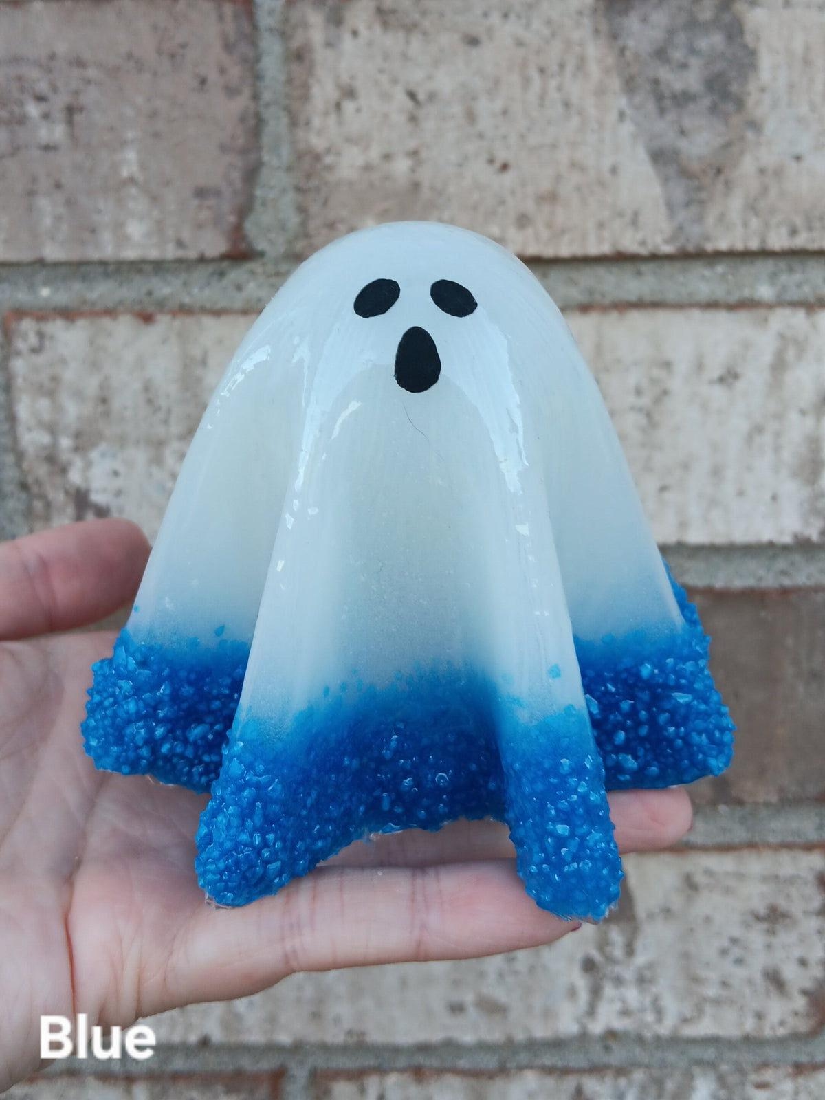 Large glow-in-the-dark ghost with blue glittery skirt and black face