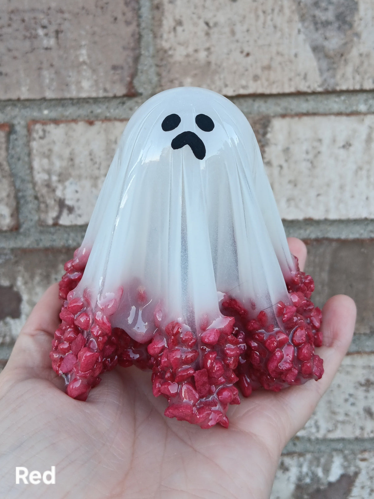 Large glow-in-the-dark ghost with red glittery base and black face