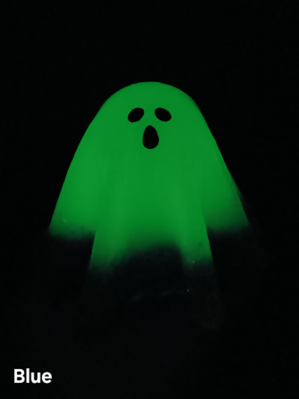 Large glow-in-the-dark ghost with green glow and black face, front view