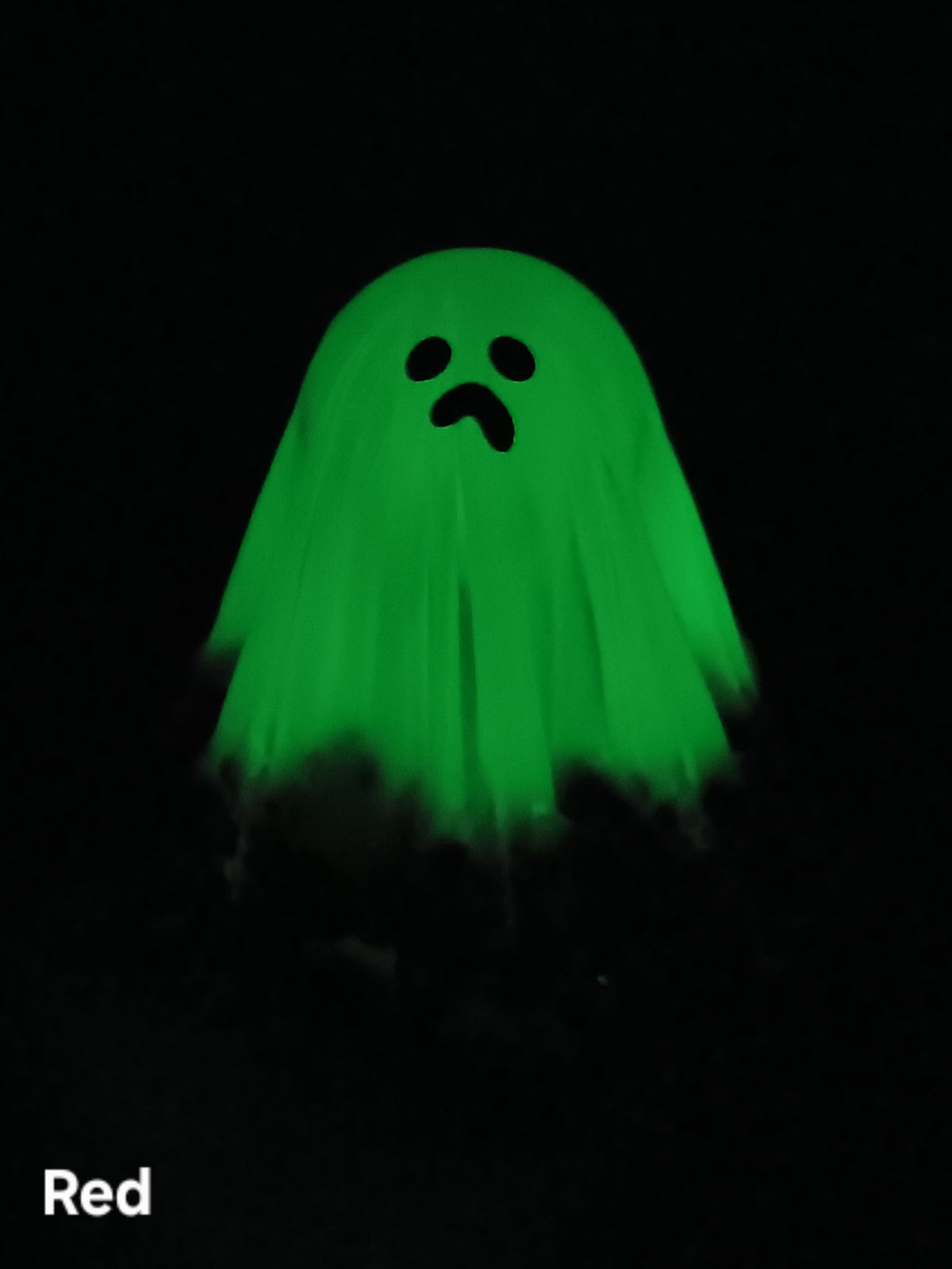 Large glow-in-the-dark ghost in bright green with black face