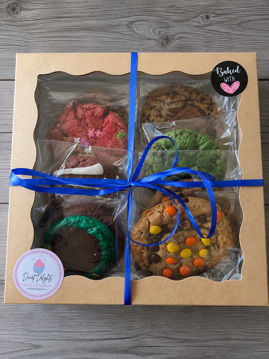 Assorted cookie gift bundle with six cookies in clear bags, tied with blue ribbon