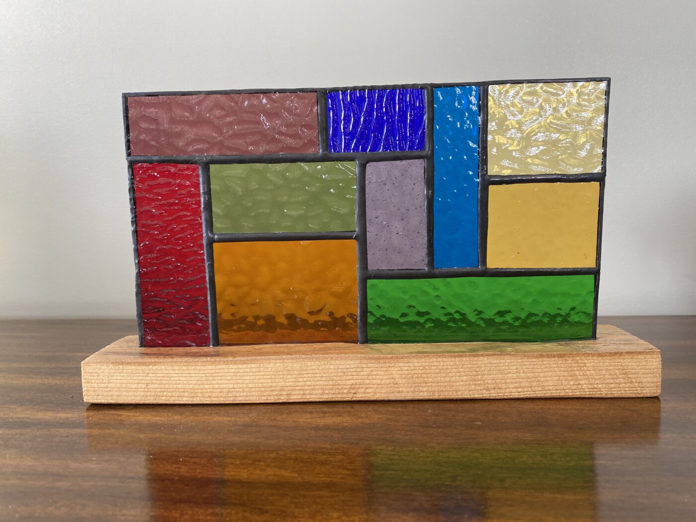 Stained Glass Geometric Design Panel on a Hardwood Base - Rainbow Colours