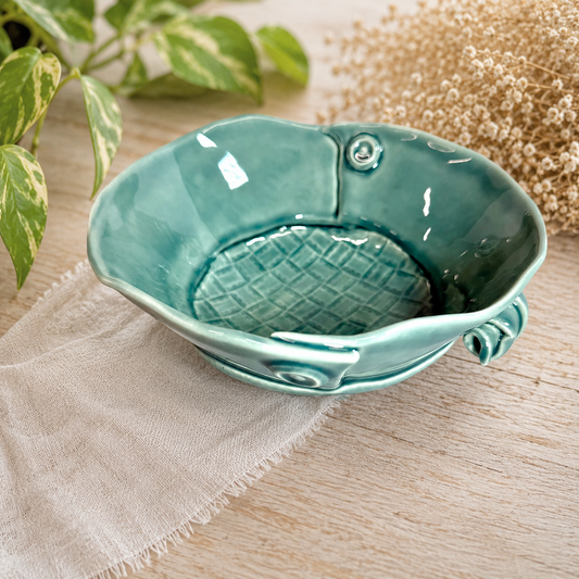 Ceramic bowl in teal with raised button detail and textured woven interior