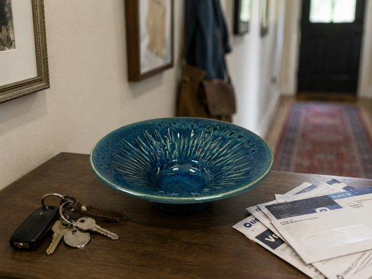 Seafoam blue ceramic decorative bowl with radial drip-glaze texture