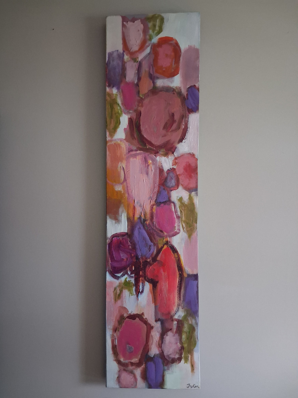 Vertical abstract art print with multicolor geometric shapes and human-like figures.