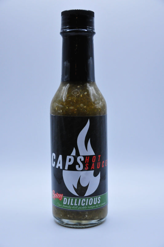 Hot sauce bottle with black label and green speckled sauce