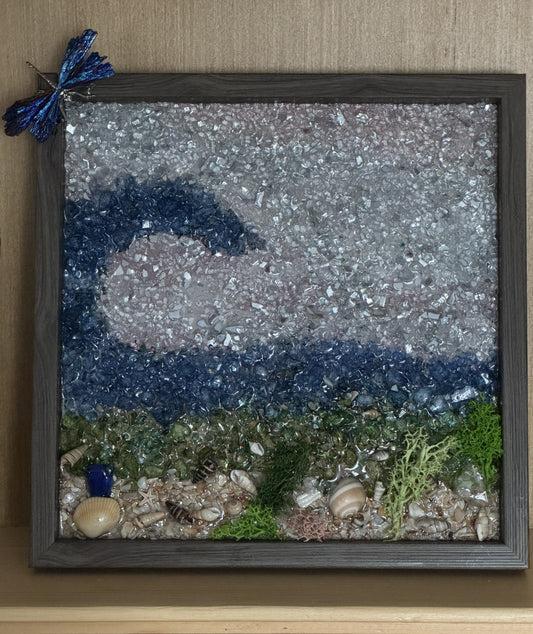 Ocean wave glitter frame with shells and sea grass, dragonfly perched top left