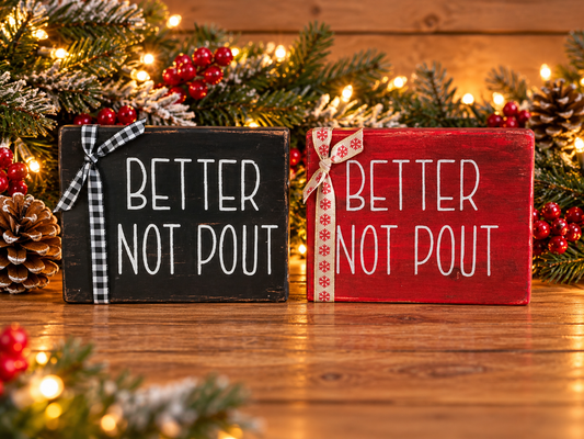 Small shelf sitters with 'BETTER NOT POUT' text, black and red