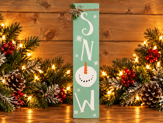 Green vertical SNOW letter sign with snowflake border and snowman hat