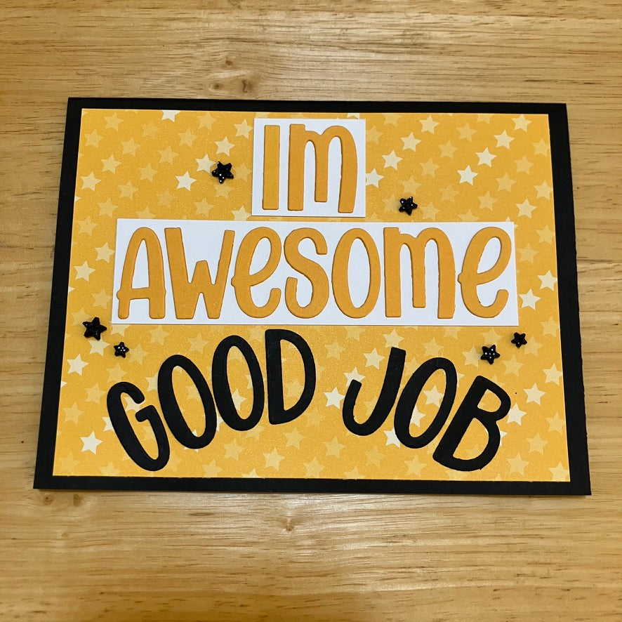 Text reads "IM AWESOME GOOD JOB". Yellow, white, and black colour scheme with star accents and star patterned background.