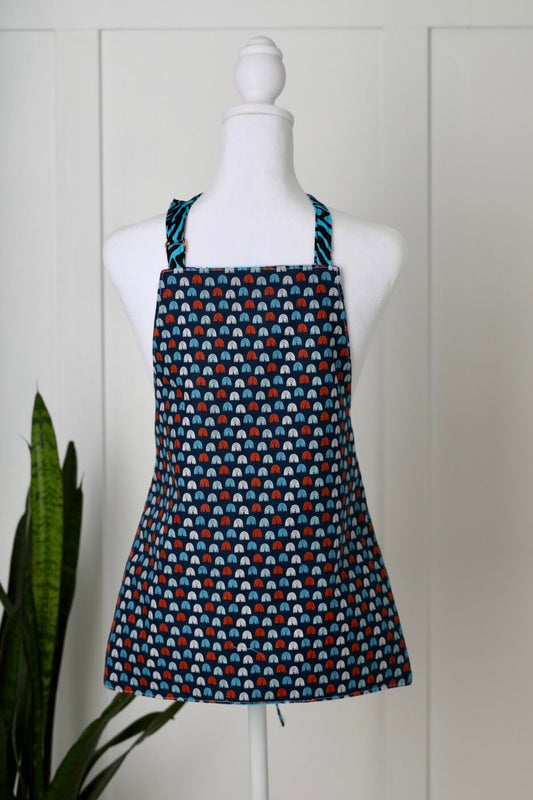Reversible Child’s Apron – Red/Blue/White Rainbow Pattern