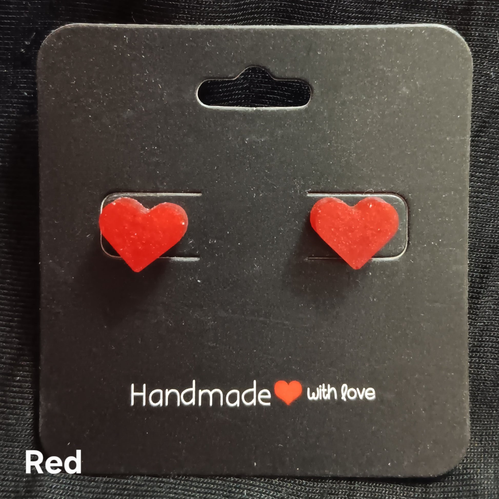 Red heart stud earrings with glittery heart stones on metal posts