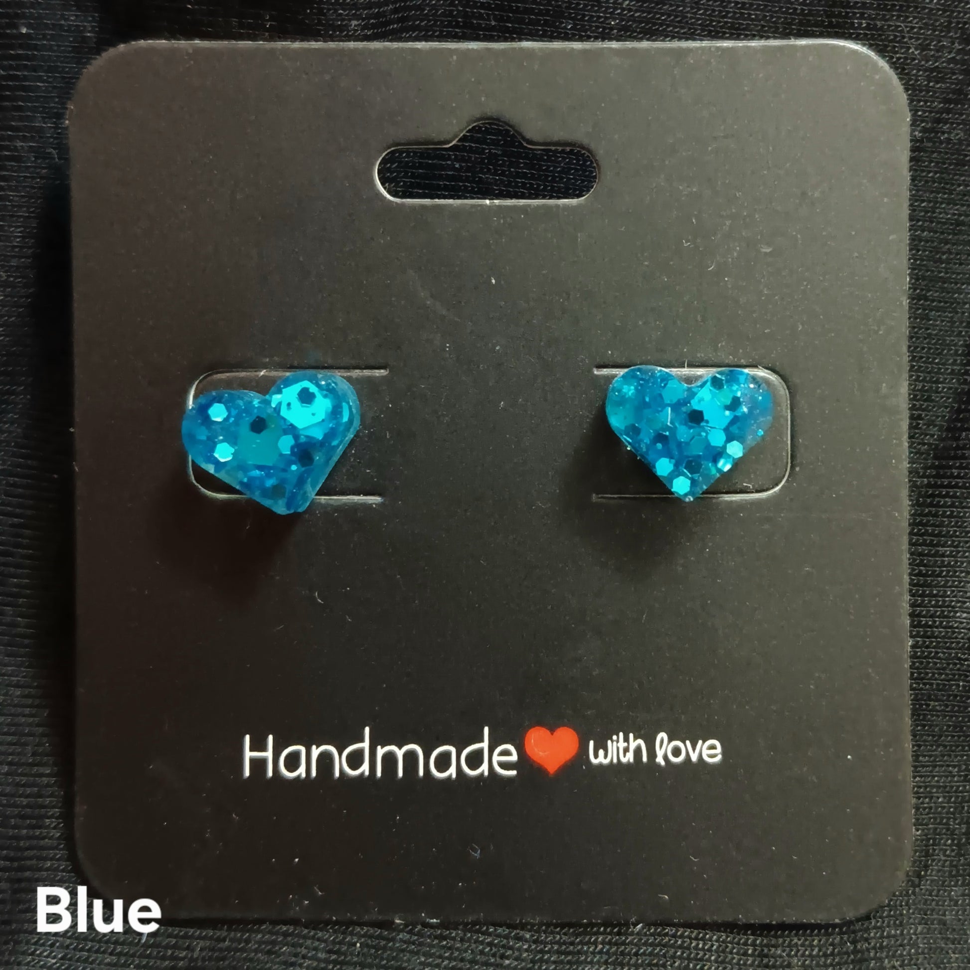 Blue heart stud earrings with glittery heart stones on metal posts