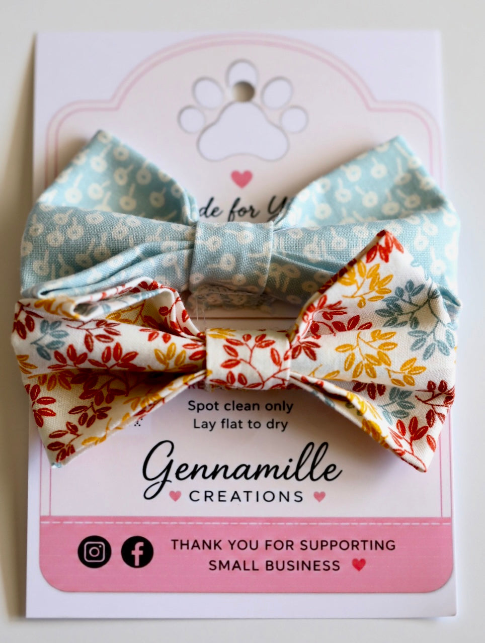 Dog bow tie with light blue dotted top and floral leaf print bottom
