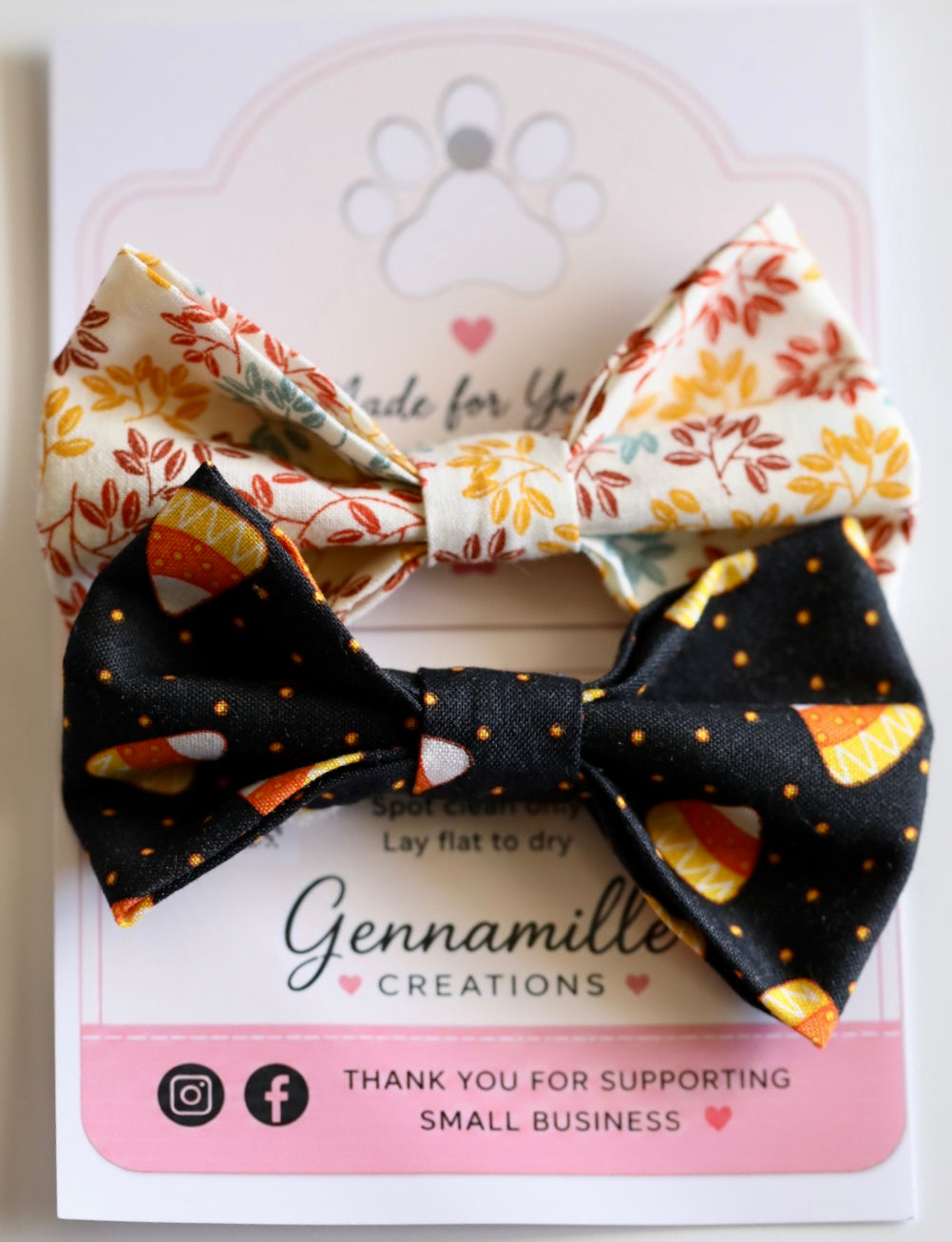 Dog bow tie with black top and autumn leaf prints on the inner sides