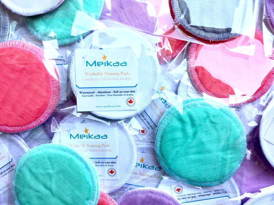 Set of reusable nursing pads in mixed colors, round with stitched edges