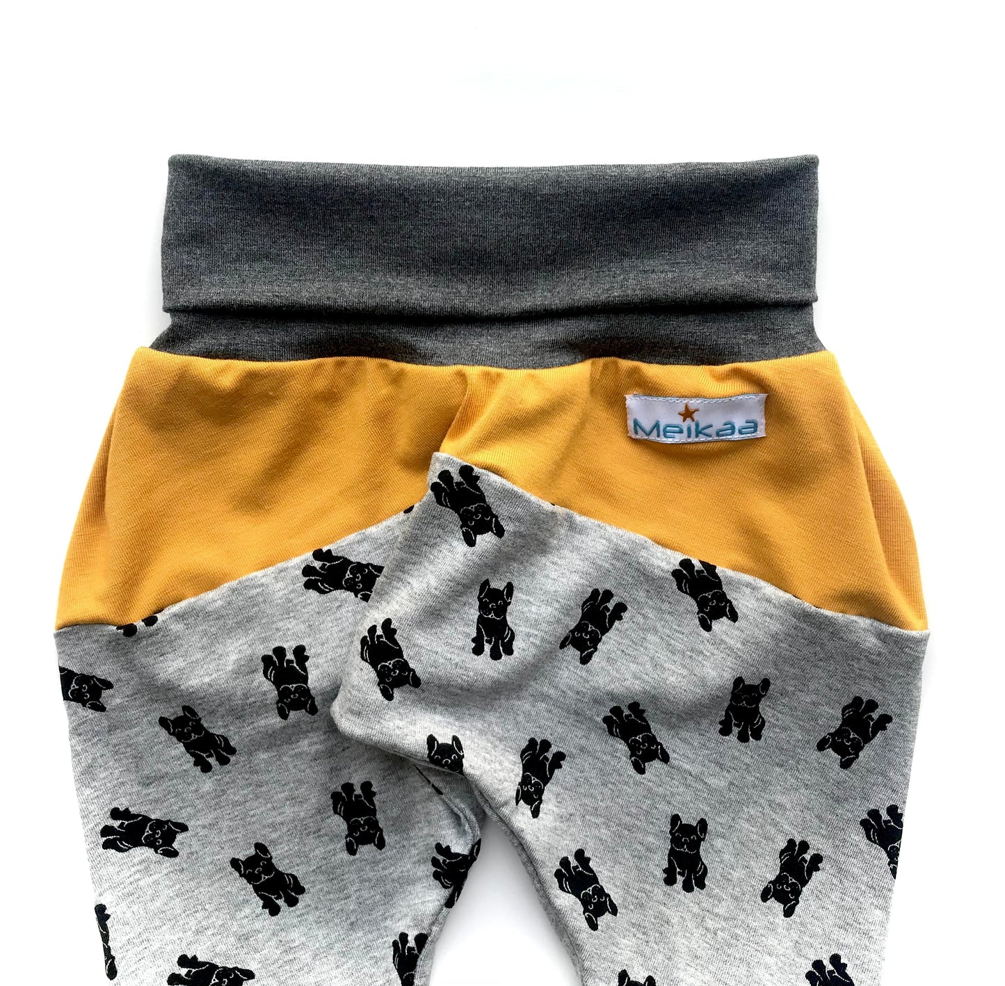 Kids grow-with-me harem pants with dog print, mustard yellow waistband panel and gray cuffs