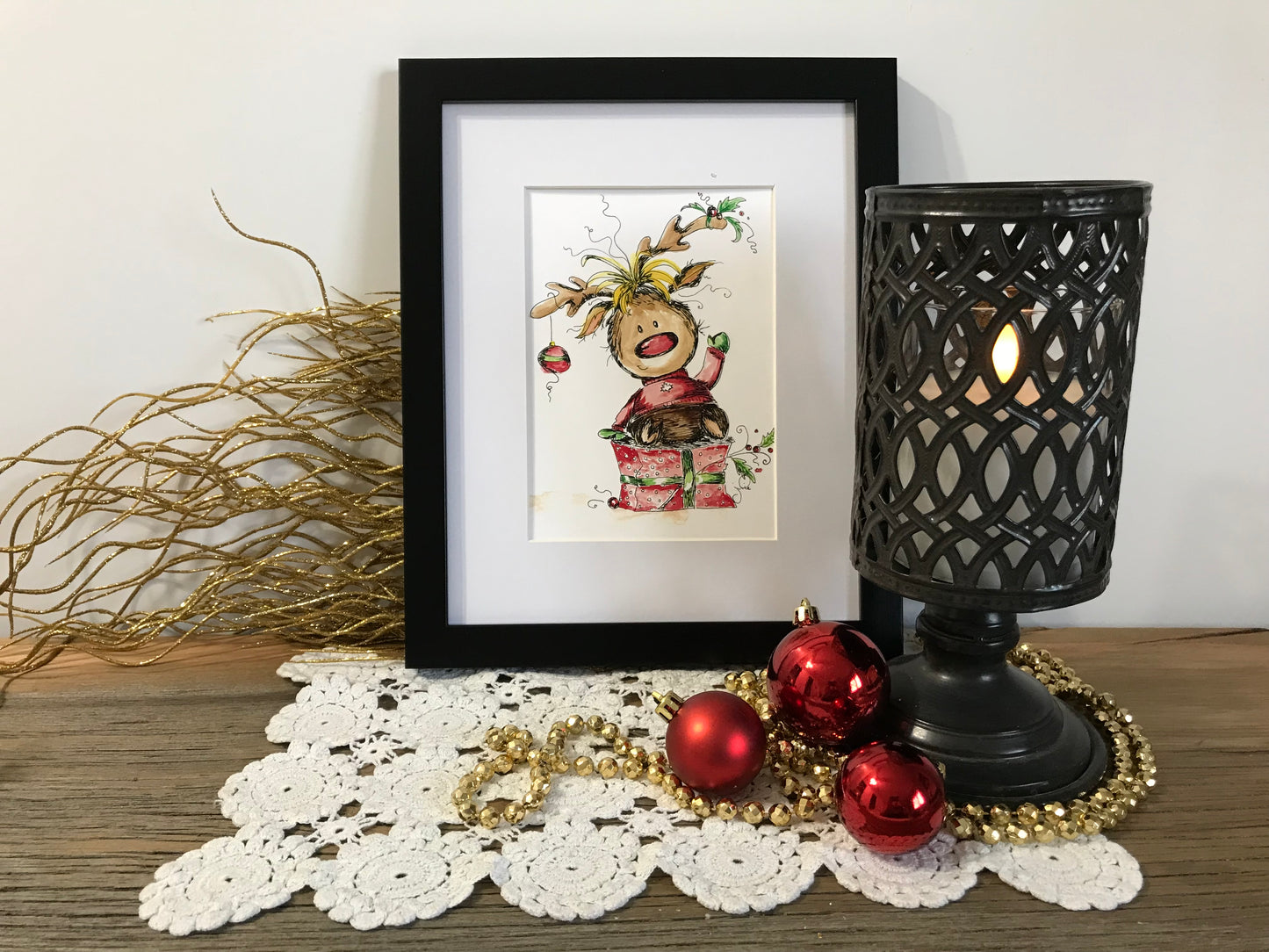 Framed Rudolph holiday print with black border and Rudolph character artwork