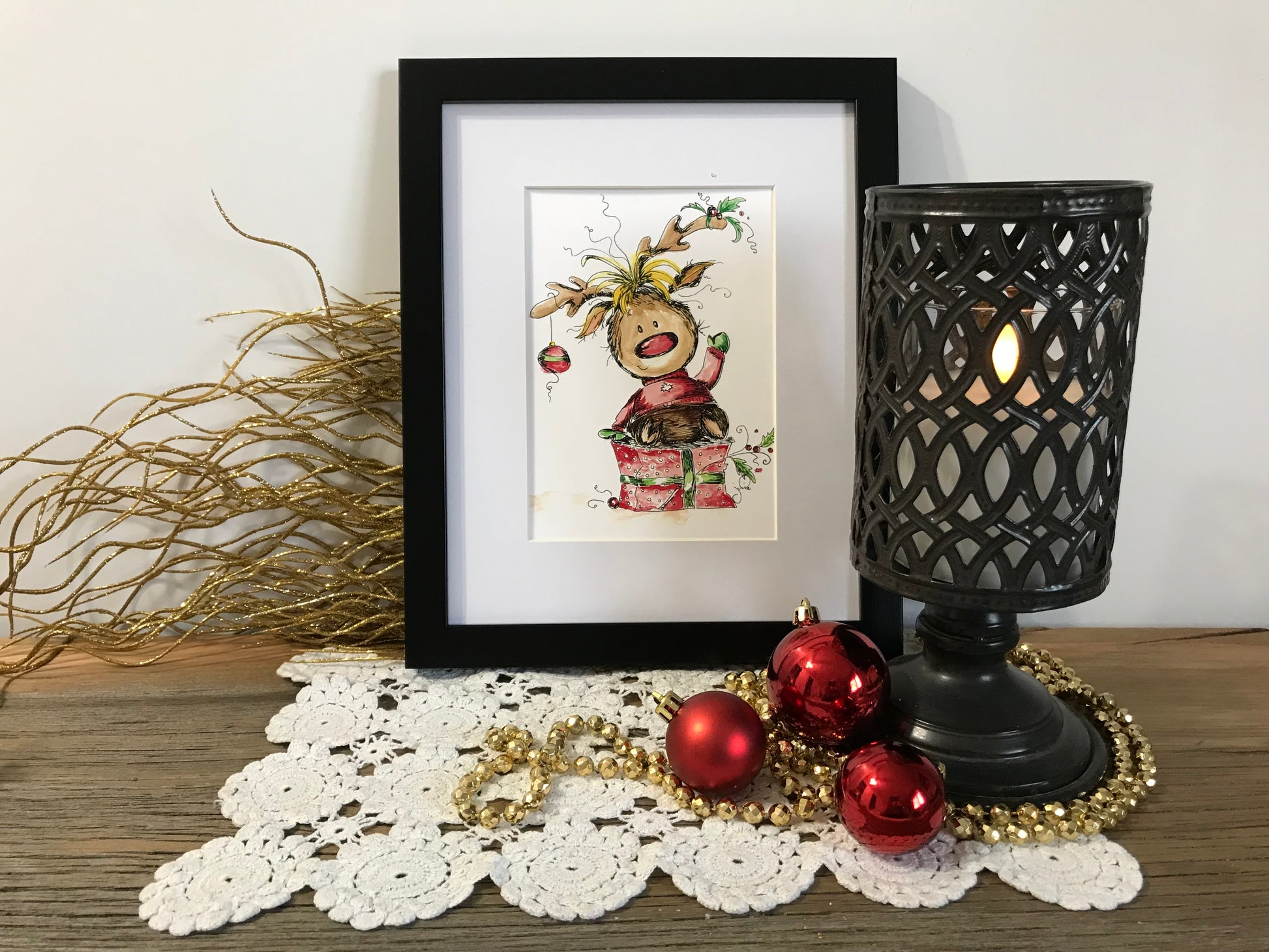 Framed Rudolph holiday print with black border and Rudolph character artwork