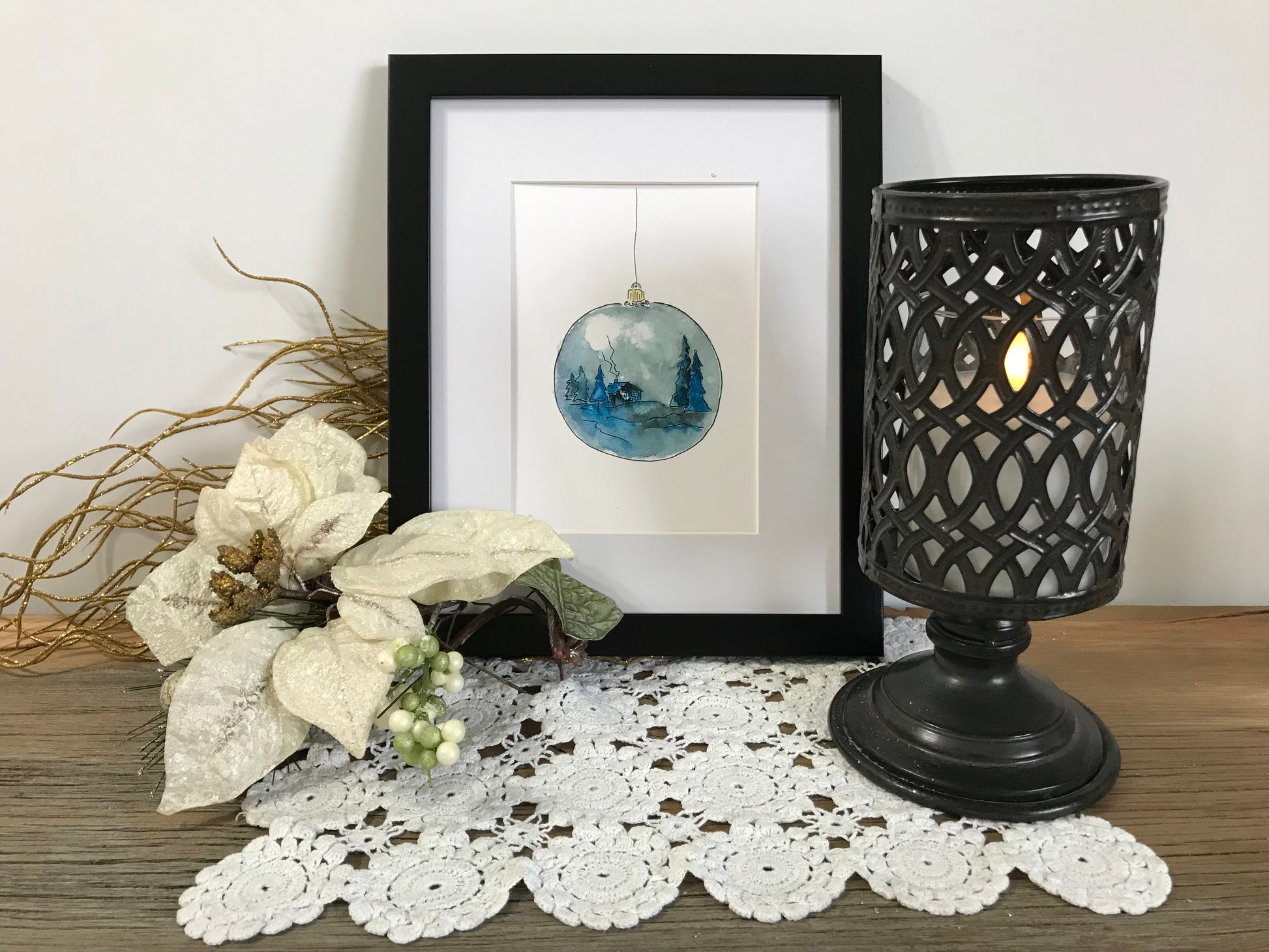 Winter blue ornament hanging bauble with painted winter landscape
