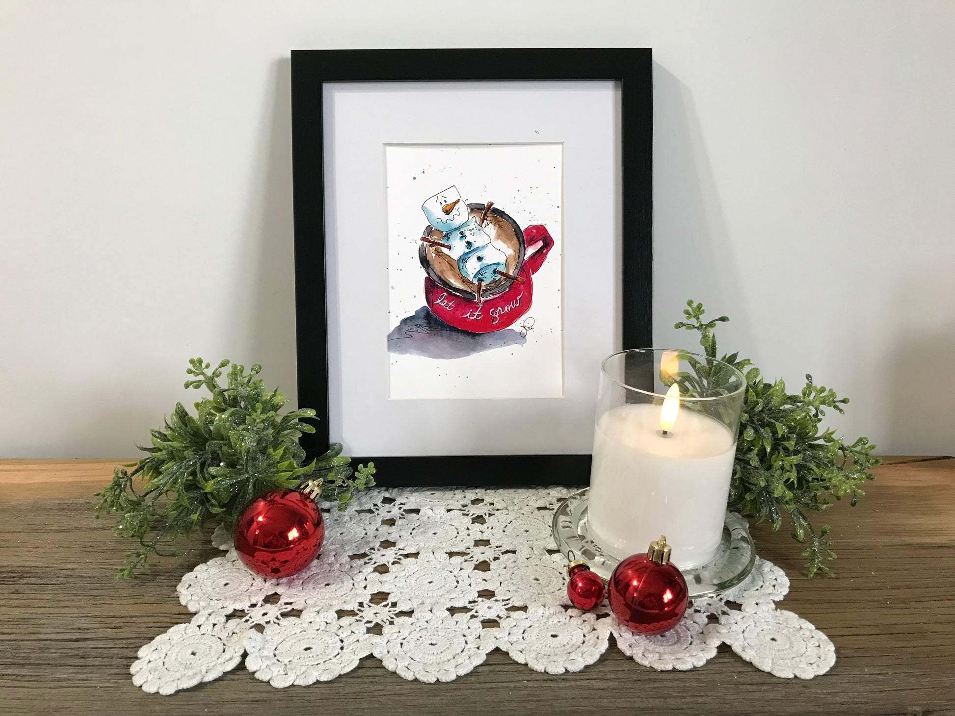 Framed winter hot chocolate illustration with snow and red kettle design