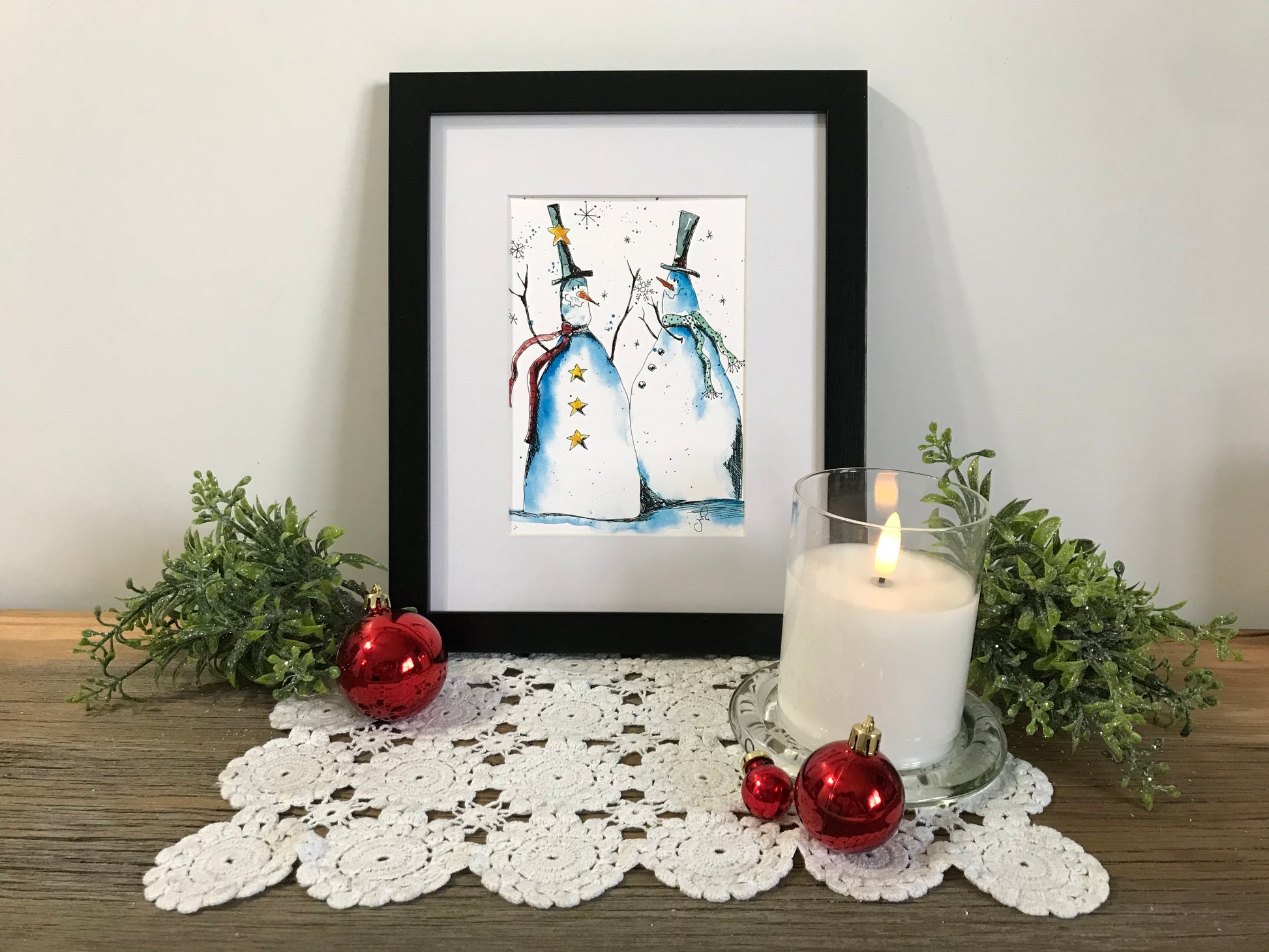 Snowman duo framed winter wall art print with two snowmen and blue hats