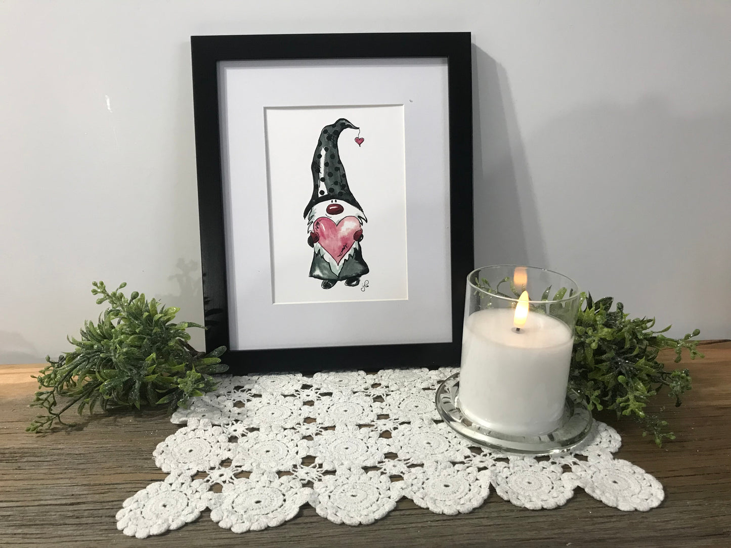 Framed gnome art print with standing gnome, pink heart, and small red heart detail