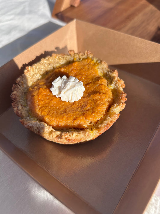 Pumpkin pie with whipped cream topping