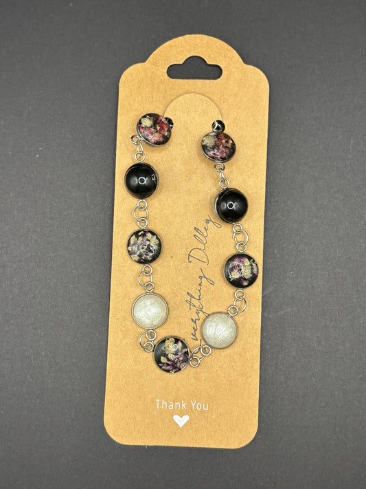 Floral beaded bracelet on hanging card, black and white round charms with silver links