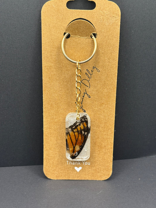 Butterfly wing keychain with gold ring and chain, clear-backed wing charm