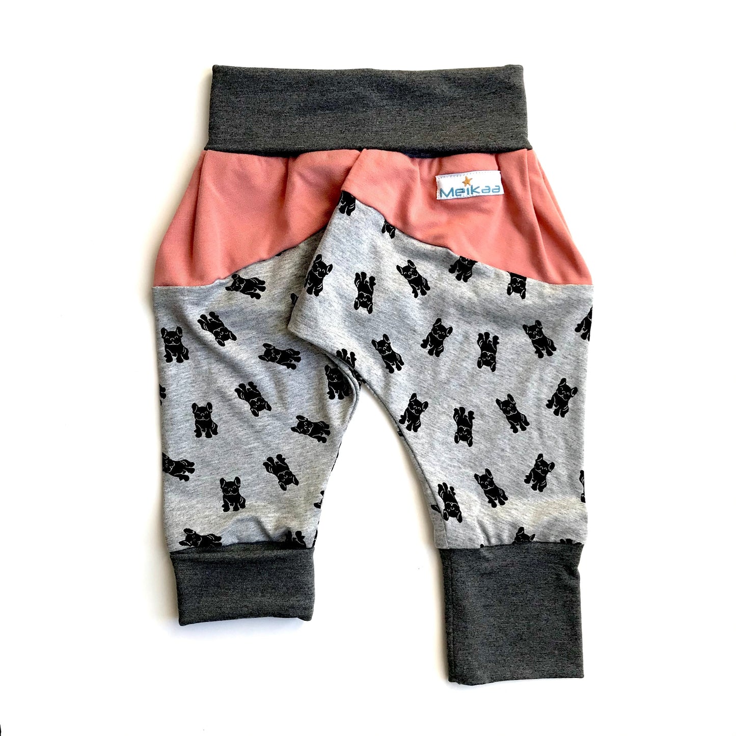 Kids grow-with-me harem pants with dog print, pink waistband panel and gray cuffs